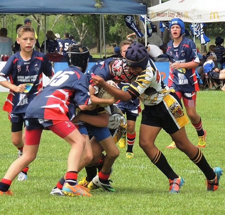 Boys playing rugby league.